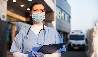 key worker holding clipboard